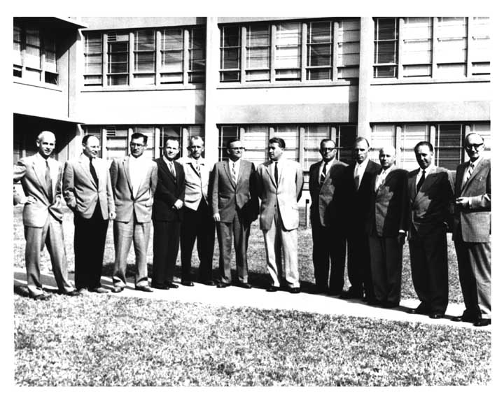 Group photo of top officials from Army Ballistic Missile Agency's famous Development Operations Division in June 1959.
				Left to right are: Dr. Ernst Stuhlinger, Director — Research Projects Office; Dr. H. Hoelzer, Director — Computation Laboratory;
				K.L. Heimburg, Director — Test Laboratory; Dr. E.D. Geissler, Director — Systems Analysis & Reliability Laboratory;
				Dr. W. Haeussermann, Director — Guidance and Control Laboratory; Dr. Wernher von Braun, Director — Development Operations Division;
				W.A. Mrazek, Director — Structures and Mechanics Laboratory; Hans Hueter, Director — System Support Equipment Laboratory;
				Eberhard Rees, Deputy Director — Development Operations Division; Dr. Kurt Debus, Director — Missile Firing Laboratory;
				H.H. Maus, Director — Fabrication and Assembly Engineering Laboratory.