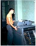 employee working with IBM 407 tabulator 1961