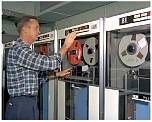 employee working with IBM 7090 1962