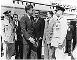 John Kennedy talking to a general at the airport