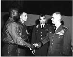 general westmoreland shaking hands with a soldier 16 jan 70