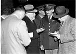 charles wilson with a geenral and reporters 14 feb 56