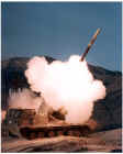MLRS rocket being fired -  rocketmlrs_1982_05.jpg (37058 bytes)