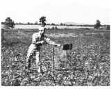 Image of Major Carroll D. Hudson shoveling dirt