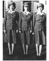 Black and white photo of three women in uniform