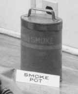 Black and white photo of canister and label "smoke pot"