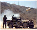 soldier firing TOW missile from a jeep