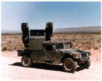 Photo of an Avenger Air Defense System, a surface-to-air missile and gun weapon system mounted on a high mobility multipurpose wheeled vehicle.