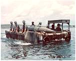 soldiers on raft with lance missile