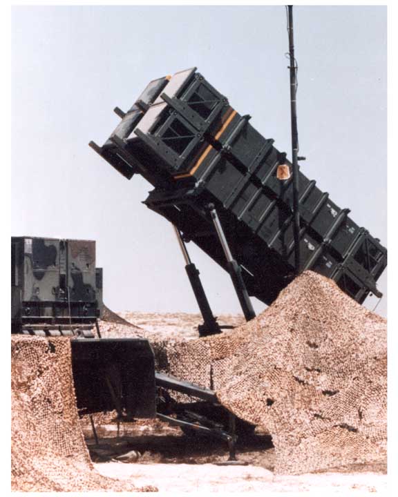Photo of PATRIOT missile system launcher in desert firing position.