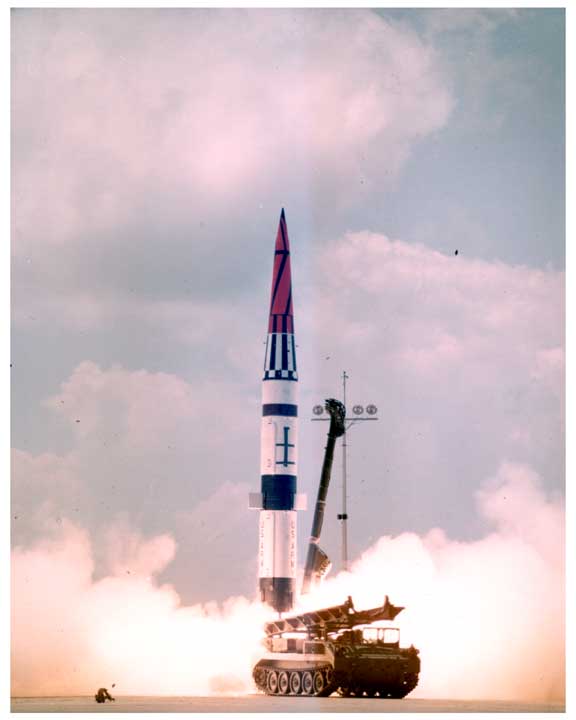 Photo of Pershing missile being launched from a track mounted launcher.
