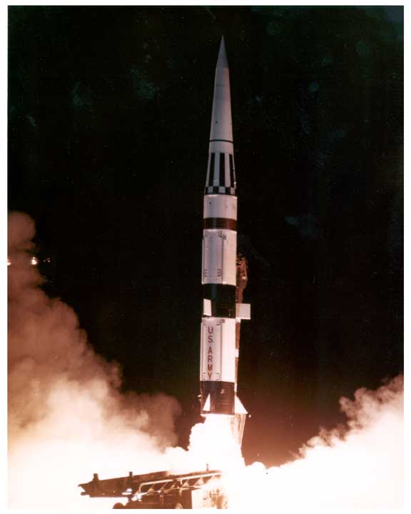 Photo of Pershing missile being launched from a track mounted launcher.